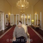 Ruth Randal (Date Unknown) at hotel in Amsterdam, The Netherlands.

[keywords]Posed, Half Length, Eyecontact, Chair, Chandelier[/keywords]